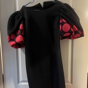 Elegant Black Dress with Red Polka Dot Sleeves